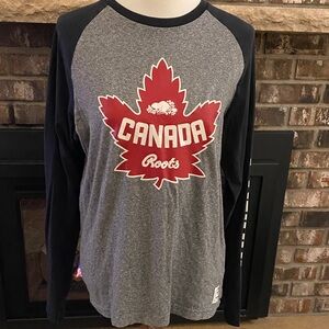 ROOTS long sleeved CANADA shirt top. Maple leaf on front. Canada on sleeve.